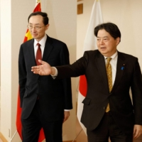 China\'s Vice Minister of Foreign Affairs Sun Weidong (left) attends a meeting with Foreign Minister Yoshimasa Hayashi in Tokyo in February.  | POOL / VIA AFP-JIJI