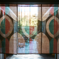 A colorful noren (traditional Japanese fabric curtain) hangs above the entrance to Noma Kyoto, separating it from the Ace Hotel. The pop-up restaurant is Noma’s second in Japan and will close its doors on May 20. | PHOTO BY KOTARO TANAKA