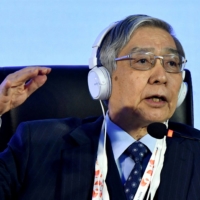 Bank of Japan Gov. Haruhiko Kuroda speaks during a news conference on the outskirts of Bengaluru, India, in February.  | REUTERS