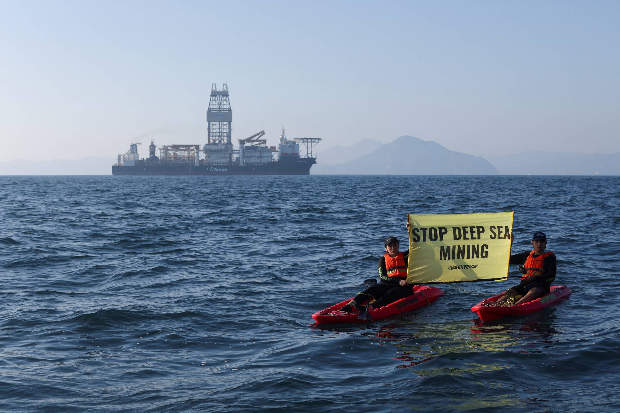 Greenpeace activists from New Zealand and Mexico confront the deep sea mining vessel Hidden Gem, commissioned by Canadian miner The Metals Company, as it returned to port from eight weeks of test mining off the coast of Manzanillo, Mexico, in November. | REUTERS