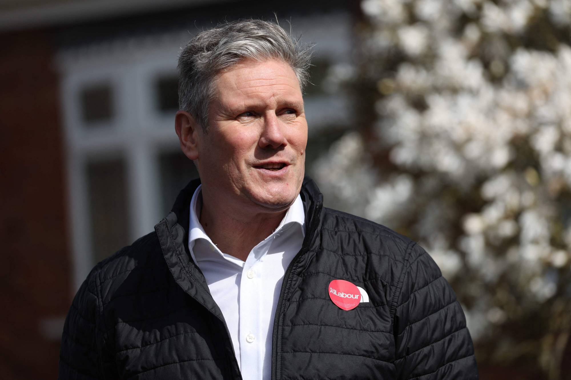 British Labour Party leader Keir Starmer speaks during an interview while canvassing voters for support in Swindon, England, on Thursday. | AFP-JIJI