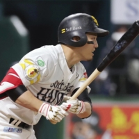 SoftBank\'s Ryoya Kurihara drives in two runs in the sixth inning against the Marines in Fukuoka on Saturday. | KYODO