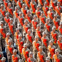 New recruits of Chinese People\'s Liberation Army attend a send-off ceremony at a railway station in Ganzhou, Jiangxi province, China, on March 16. | CHINA DAILY / VIA REUTERS 