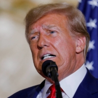 Former U.S. President Donald Trump delivers remarks after being indicted by a Manhattan grand jury following a probe into hush money paid to porn star Stormy Daniels, in Palm Beach, Florida, on Tuesday | REUTERS