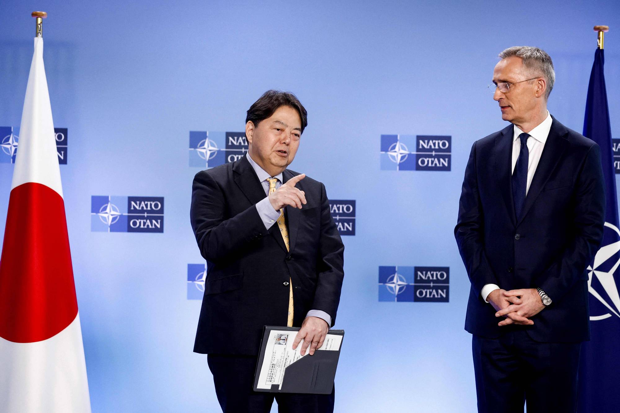 Foreign Minister Yoshimasa Hayashi and NATO Secretary General Jens Stoltenberg hold a news conference following a NATO foreign ministers meeting in Brussels on Tuesday. | AFP-JIJI