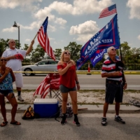 Supporters of former U.S. President Donald Trump outside the Mar-a-Lago Club owned by Trump, in Palm Beach, Florida, on Sunday | HILARY SWIFT / THE NEW YORK TIMES