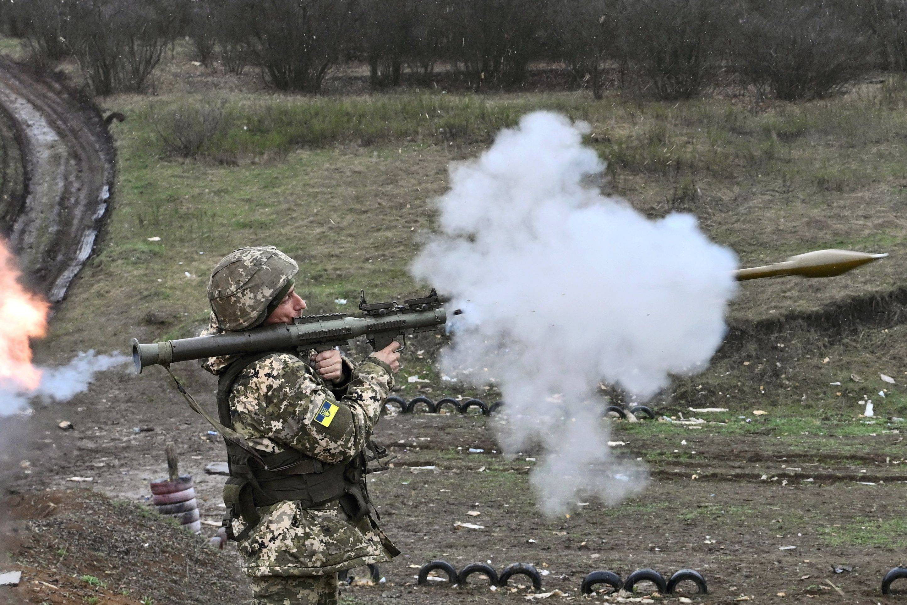 A Ukrainian serviceman fires a rocket-propelled grenade during a training exercise in the Donetsk region on Thursday. | AFP-JIJI