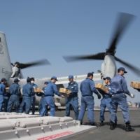 Members of the Maritime Self-Defense Force support the government\'s relief efforts following the deadly Kumamoto earthquakes in April 2016. | U.S. NAVY / REUTERS