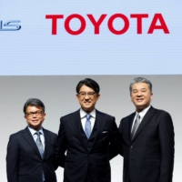 Toyota’s new CEO Koji Sato poses for a photo together with Executive Vice Presidents Yoichi Miyazaki and Hiroki Nakajima during a news conference in Tokyo on Friday. | REUTERS