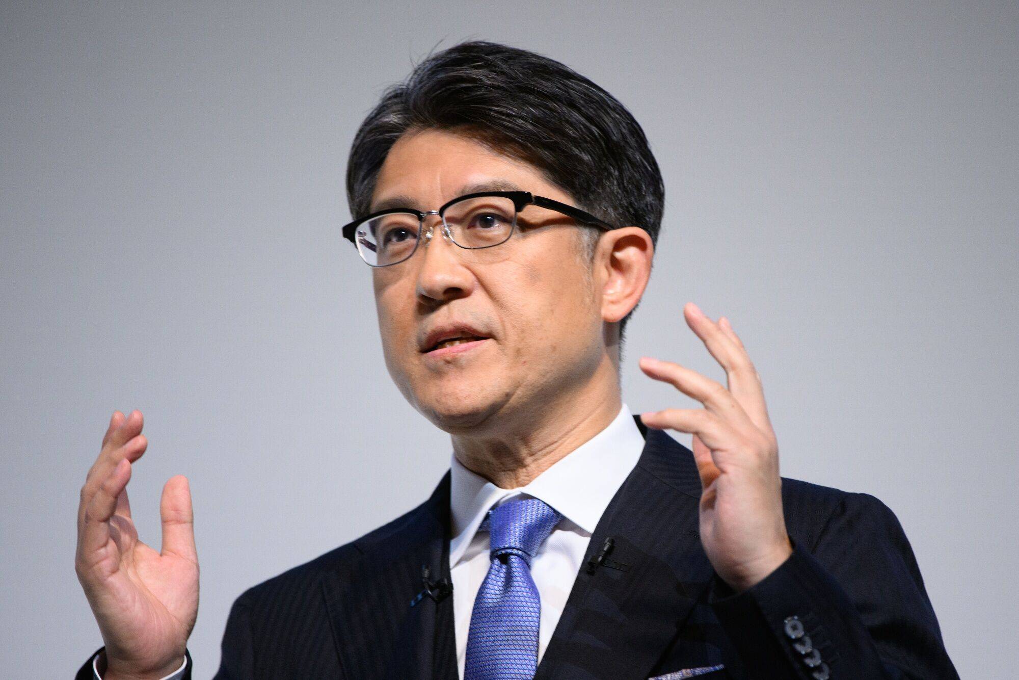 Sato during a news conference in Tokyo on Friday. The CEO unveiled the beginnings of a long-awaited plan to electrify the automaker’s vehicle lineup during his first news conference, but stopped short of revealing how the company will match its EV rivals. | Bloomberg