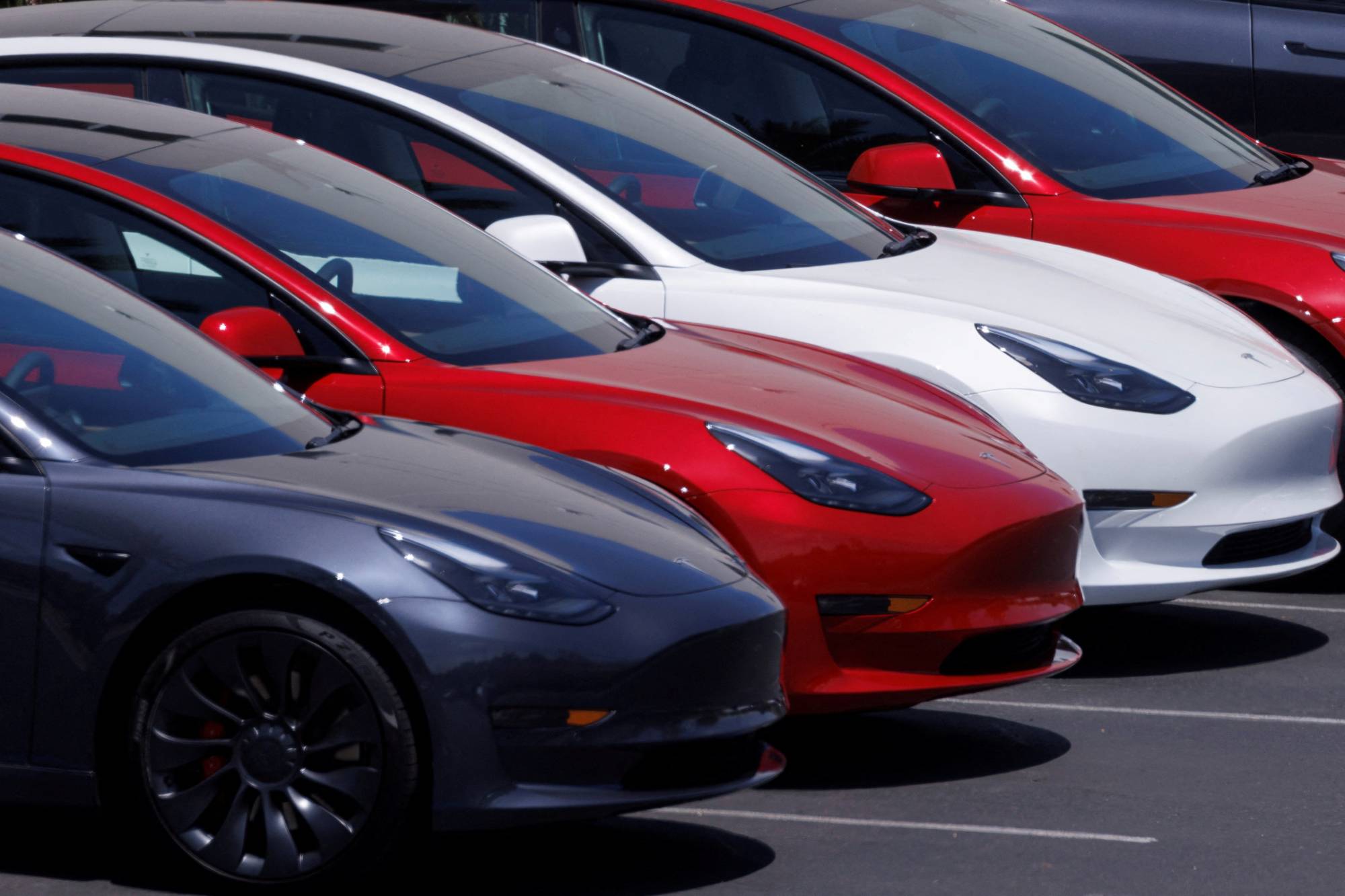 Tesla vehicles at a sales and service center in Vista, California, in June 2022 | REUTERS