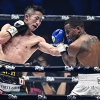 Takuma Inoue (left) fights Liborio Solis during their WBA bantamweight world title bout at Tokyo\'s Ariake Arena on Saturday. | AFP-JIJI