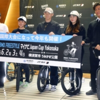 Freestyle BMX rider Rim Nakamura (center) and others pose for photos at a news conference announcing the Japan Cup in Yokosuka, Kanagawa Prefecture, on Friday. | KYODO