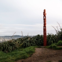 A Maori statue stands on the ridge of Mount Victoria in Wellington, New Zealand, in July 2020. While AI technology could help preserve Indigenous languages, some worry that harvesting data without consent risks distorting the culture.  | BLOOMBERG