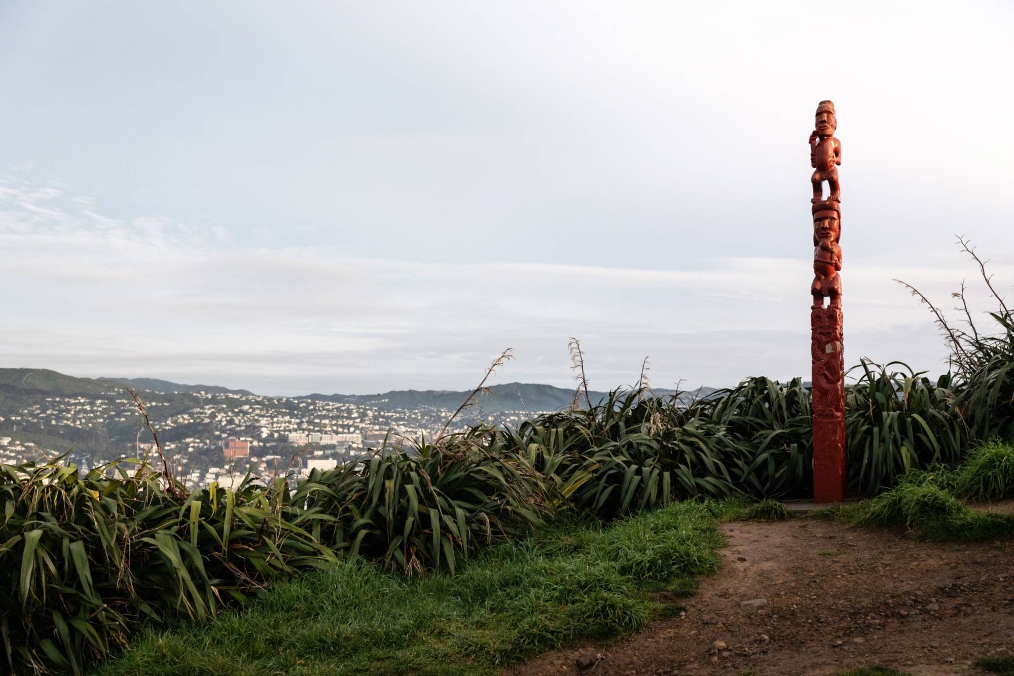 A Maori statue stands on the ridge of Mount Victoria in Wellington, New Zealand, in July 2020. While AI technology could help preserve Indigenous languages, some worry that harvesting data without consent risks distorting the culture.  | BLOOMBERG
