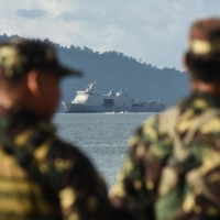 Philippine marines look on as the Philippine Navy ship BRP Tarlac docks in Casiguran Province, Philippines, in May 2017. | GETTY IMAGES 