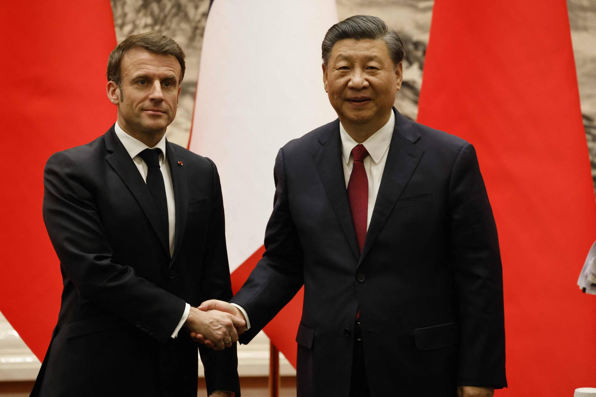 French President Emmanuel Macron and Chinese leader Xi Jinping hold a news conference at the Great Hall of the People in Beijing on Thursday.    | AFP-JIJI
