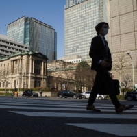 The Bank of Japan headquarters in Tokyo. An International Monetary Fund report said clear communication in the event of adjustments to the BOJ\'s monetary policy is critical to avoid market volatility. | BLOOMBERG