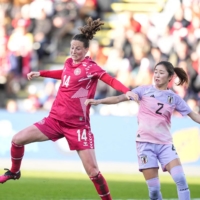 Denmark\'s Nicoline Soerensen (left) and Japan\'s Risa Shimizu vie the ball during an international friendly in Odense, Denmark, on Tuesday. | AFP-JIJI