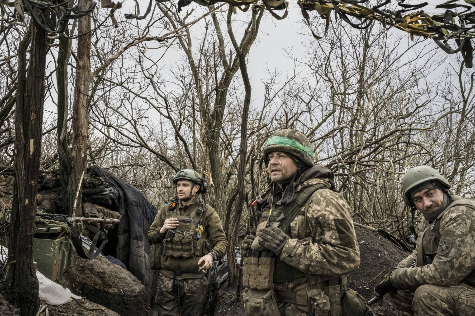 Ukrainian soldiers at a front line position in southern Bakhmut, Ukraine, watching the horizon where Russian troops are stationed, on April 7 | Mauricio Lima / The New York Times