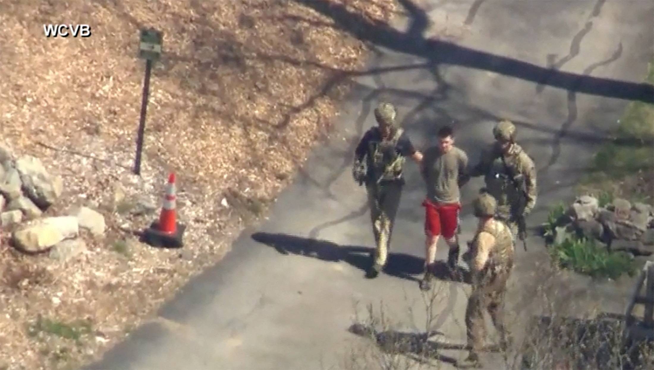 FBI agents arrest Jack Teixeira, an employee of the U.S. Air Force National Guard, in connection with an investigation into the leaks online of classified U.S. documents, outside a residence in this still image taken from video in North Dighton, Massachusetts, on Thursday | WCVB-TV / ABC / VIA REUTERS