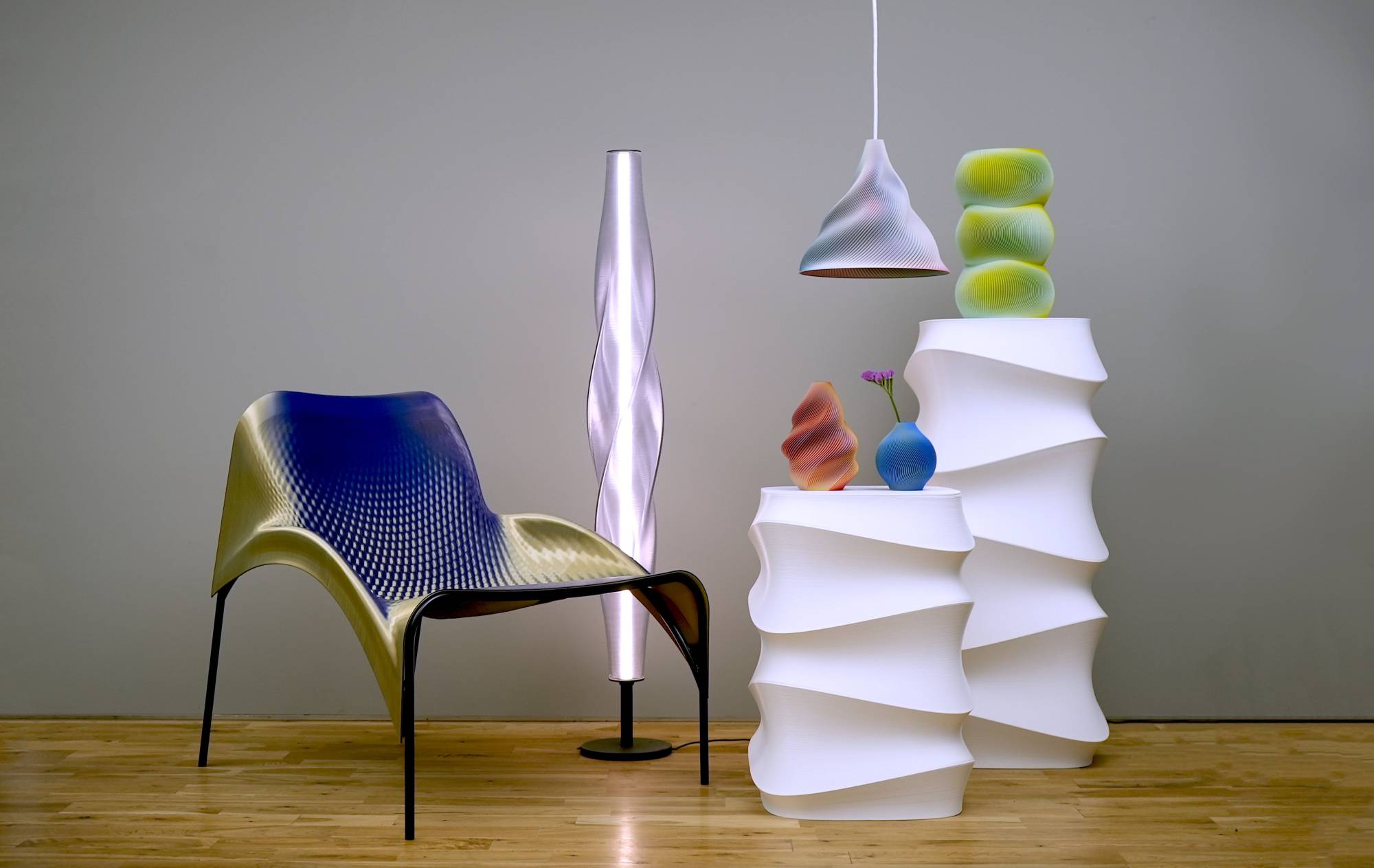 3D-printing design firm Sekisai’s “Phantasmagorical Skin” vases, lampshades and chair, displayed at “Co-Breathing” as part of Milan design week’s Salone Satellite, seem to change in color when viewed from different angles. | COURTESY OF SEKISAI