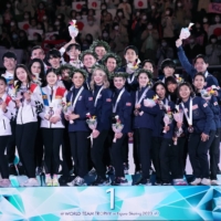 South Korean, American and Japanese skaters celebrate on the podium after the final day of the ISU World Team Trophy at Tokyo Metropolitan Gymnasium on Saturday. | INTERNATIONAL SKATING UNION