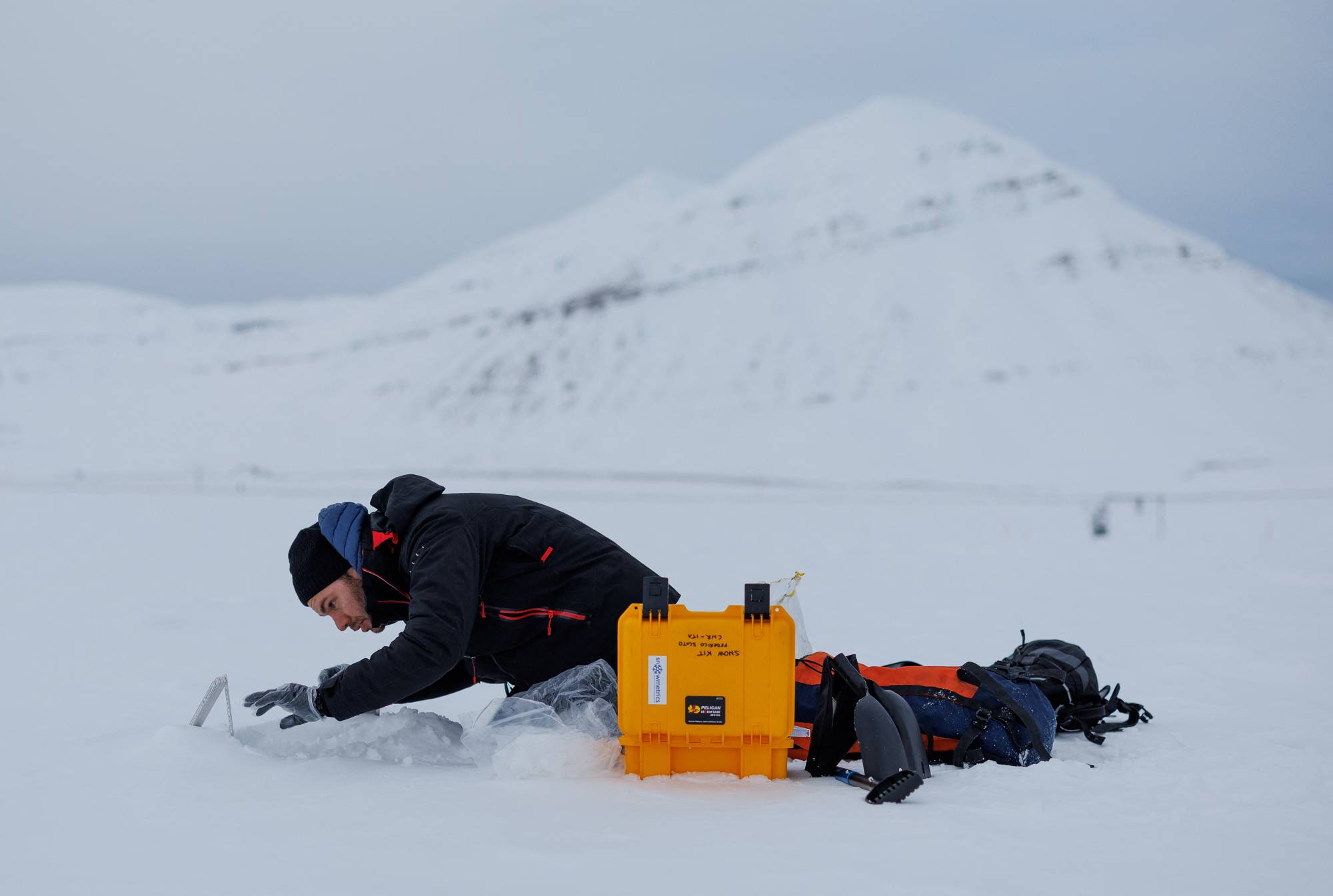 Francois Burgay, 34, prepares to take a snow sample to detect molecules connected to algal bloom in Ny-Aalesund, Svalbard, Norway | REUTERS