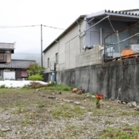 An empty lot in Higashihiroshima, Hiroshima Prefecture, where the body of a baby boy was found earlier this week | KYODO