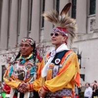 Indigenous people dance during an Earth Day event on Saturday in New York. | AFP-JIJI