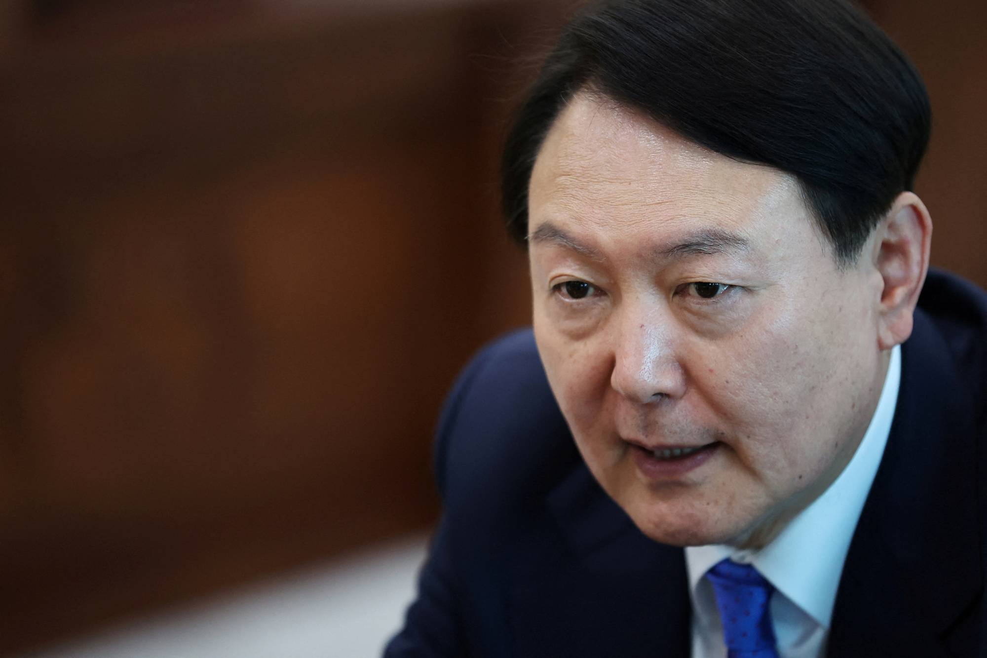 South Korean President Yoon Suk-yeol speaks during an interview earlier this month. | REUTERS