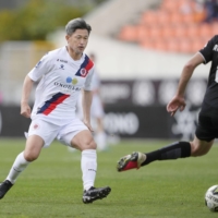 Kazuyoshi Miura makes his debut for Portuguese second-division club Oliveirense in Viseu, Portugal, on Saturday. | KYODO
