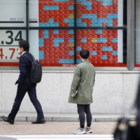 Investors in Japan are focusing more on foreign currencies and local stocks, as many of them are determined to wait and see before investing in Japanese government bonds. | BLOOMBERG
