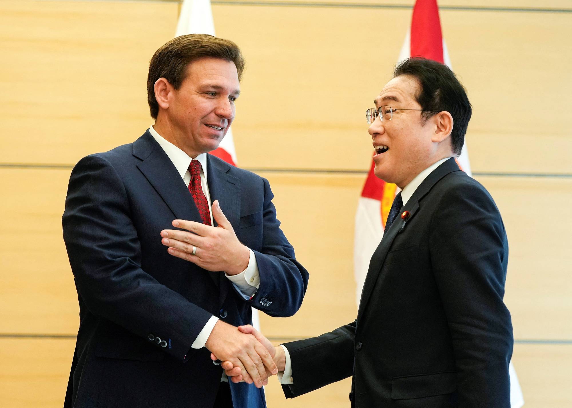 Florida Gov. Ron DeSantis shakes hands with Prime Minister Fumio Kishida as he pays a courtesy call at the Prime Minister's Office in Tokyo on Monday.  | POOL / VIA REUTERS