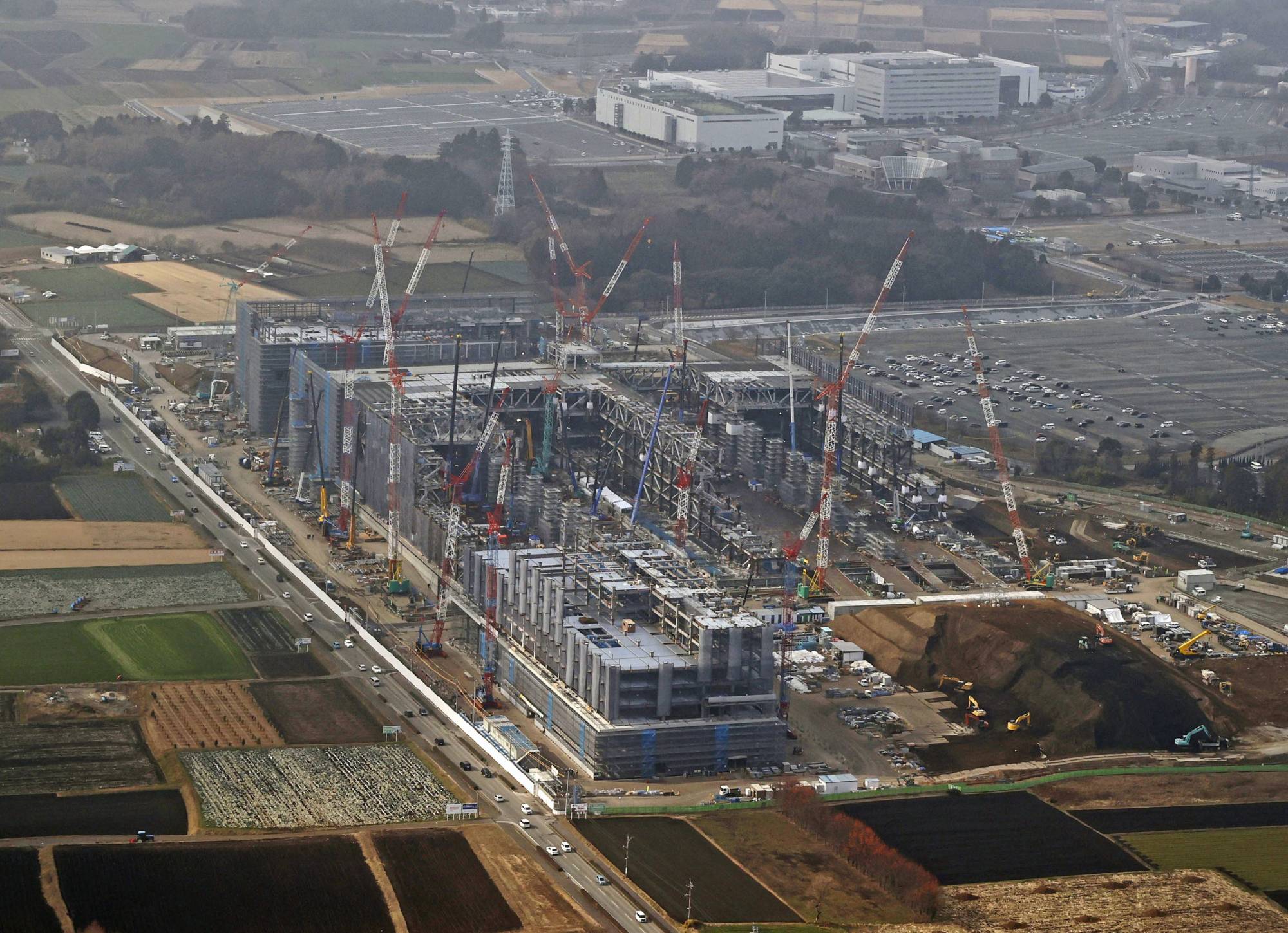 Taiwan Semiconductor Manufacturing Co.'s new factory under construction in Kikuyo, Kumamoto Prefecture, in January. Japan aims to boost direct investment by foreign companies to ¥100 trillion by 2030. | KYODO
