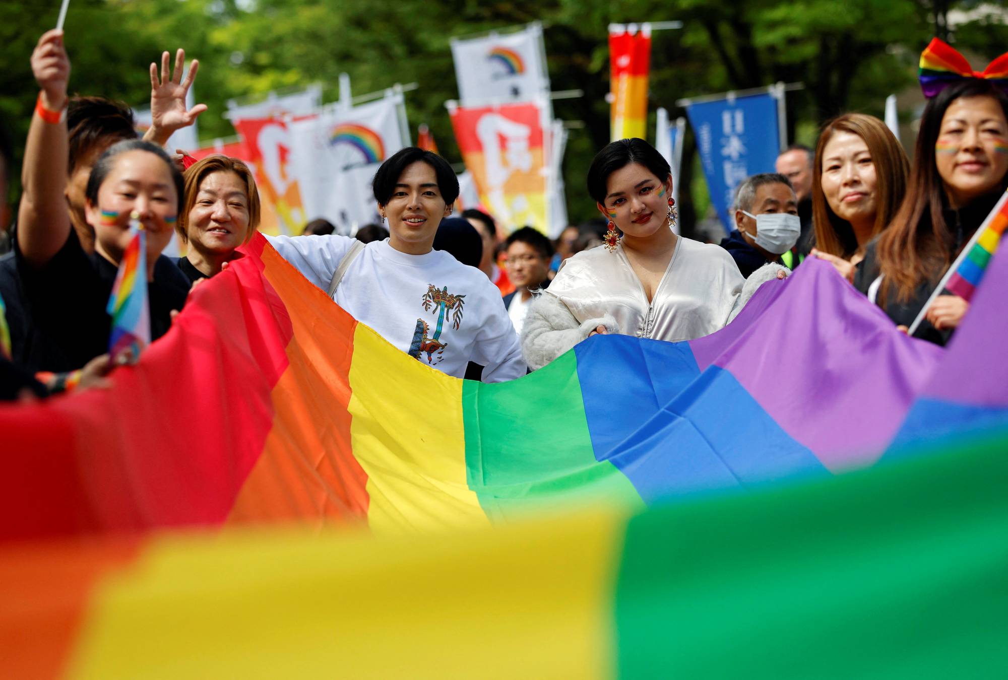 Participants march during the Tokyo Rainbow Pride parade, celebrating advances in LGBTQ rights and calling for marriage equality, in Tokyo on Sunday. | REUTERS