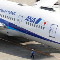 ANA Holdings posted its first annual profit in three years in the year that ended in March, as travel demand returned. | REUTERS