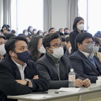 Foreign students learns about Japanese companies, in Beppu, Oita Prefecture. in January. A government panel has called for Japan to accept 400,000 international students by 2033. | RITSUMEIKAN ASIA PACIFIC UNIVERSITY / VIA KYODO
