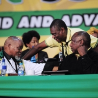 Gwede Mantashe (left) and Cyril Ramaphosa (right) speak to Deputy President Paul Mashatile, who was then the ANC treasurer general, at the 55th national conference of the party in Johannesburg  | BLOOMBERG