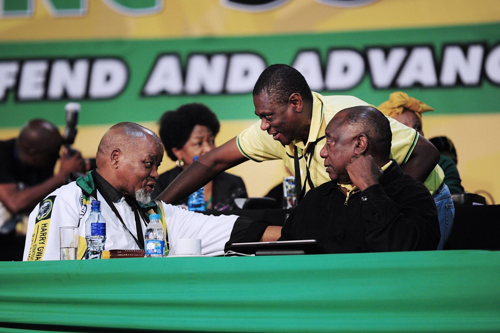 Gwede Mantashe (left) and Cyril Ramaphosa (right) speak to Deputy President Paul Mashatile, who was then the ANC treasurer general, at the 55th national conference of the party in Johannesburg | Bloomberg