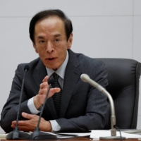 Bank of Japan Gov. Kazuo Ueda speaks during a news conference at the BOJ\'s headquarters in Tokyo on Friday following a policy meeting. | REUTERS