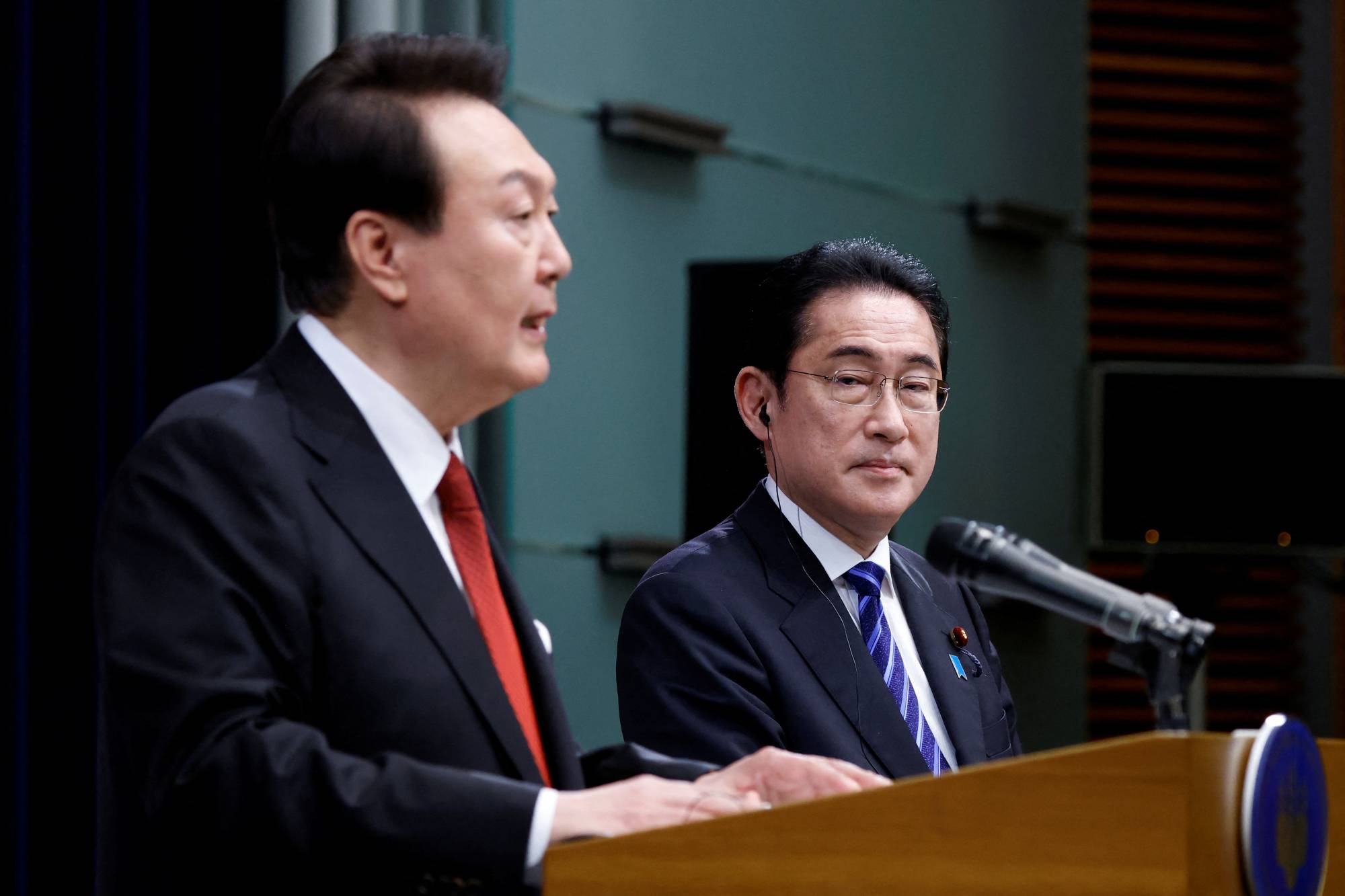 South Korean President Yoon Suk-yeol and Prime Minister Fumio Kishida hold a joint news conference in Tokyo in March.  | POOL / VIA REUTERS