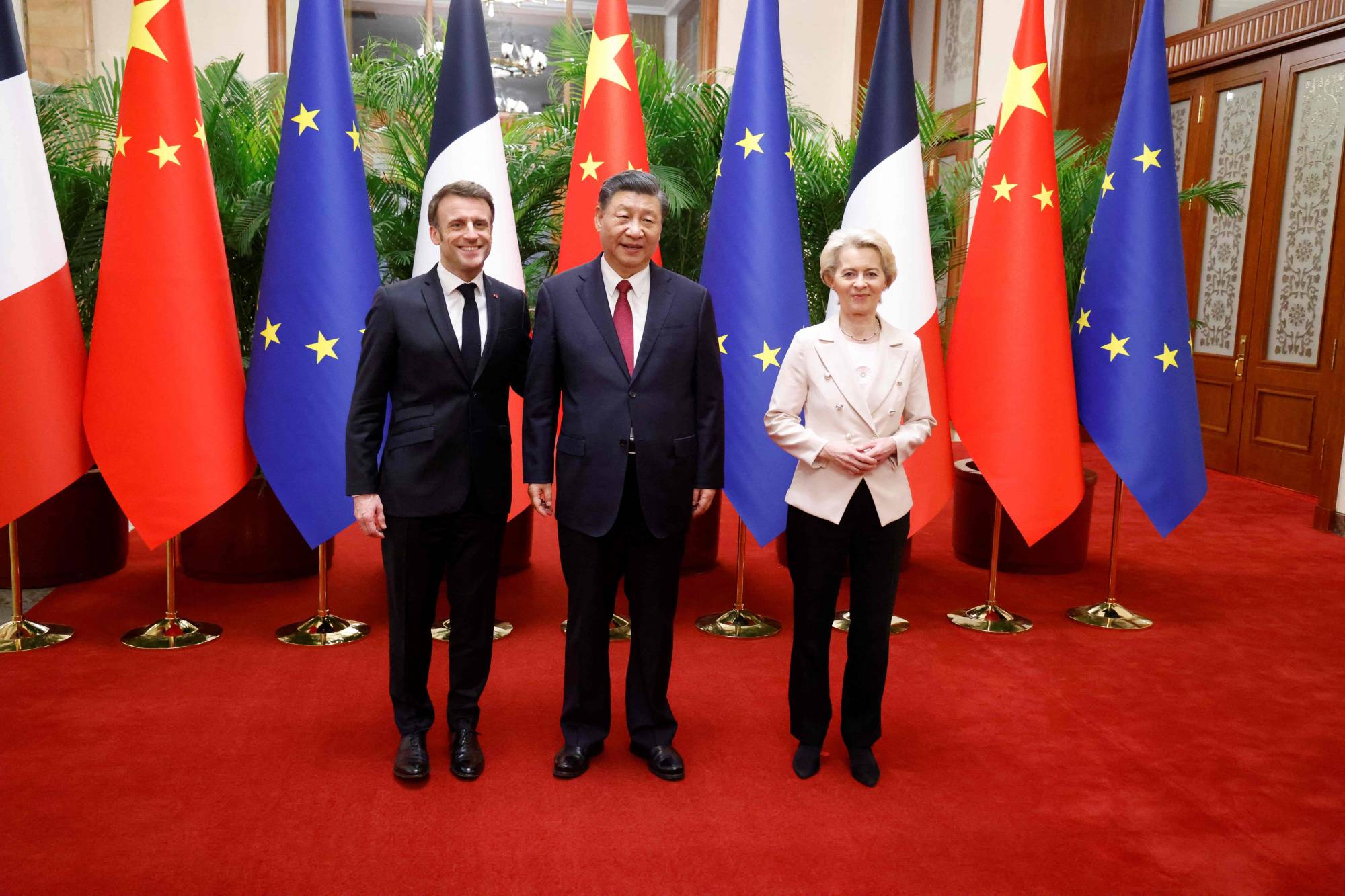 Chinese leader Xi Jinping, his French counterpart, Emmanuel Macron, and European Commission President Ursula von de Leyen meet in Beijing on April 6. | POOL / VIA AFP-JIJI