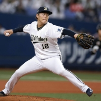 Orix\'s Yoshinobu Yamamoto pitches against the Marines in Osaka on Saturday. | KYODO