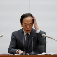 New Bank of Japan Gov. Kazuo Ueda gives a news conference at the bank\'s headquarters in Tokyo on Friday.  | REUTERS 
