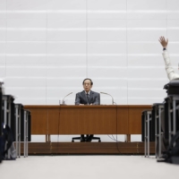 New Bank of Japan Gov. Kazuo Ueda holds a news conference at the bank\'s headquarters in Tokyo on Friday. | BLOOMBERG