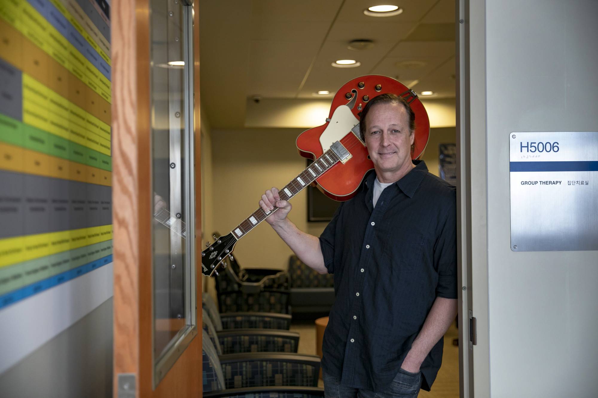 Lt. Cmdr. D.E. McShane, former joint duty officer in Panmunjom, after guitar lessons with wounded veterans at Camp Humphreys, in the Demilitarized Zone of the Korean Peninsula, on April 13. McShane, now retired, served for a record eight years in the position.  | WOOHAE CHO / THE NEW YORK TIMES