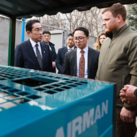 Prime Minister Fumio Kishida inspects power generators provided by the Japanese government during his visit to Bucha, Ukraine, on March 21. | CABINET PUBLIC AFFAIRS OFFICE