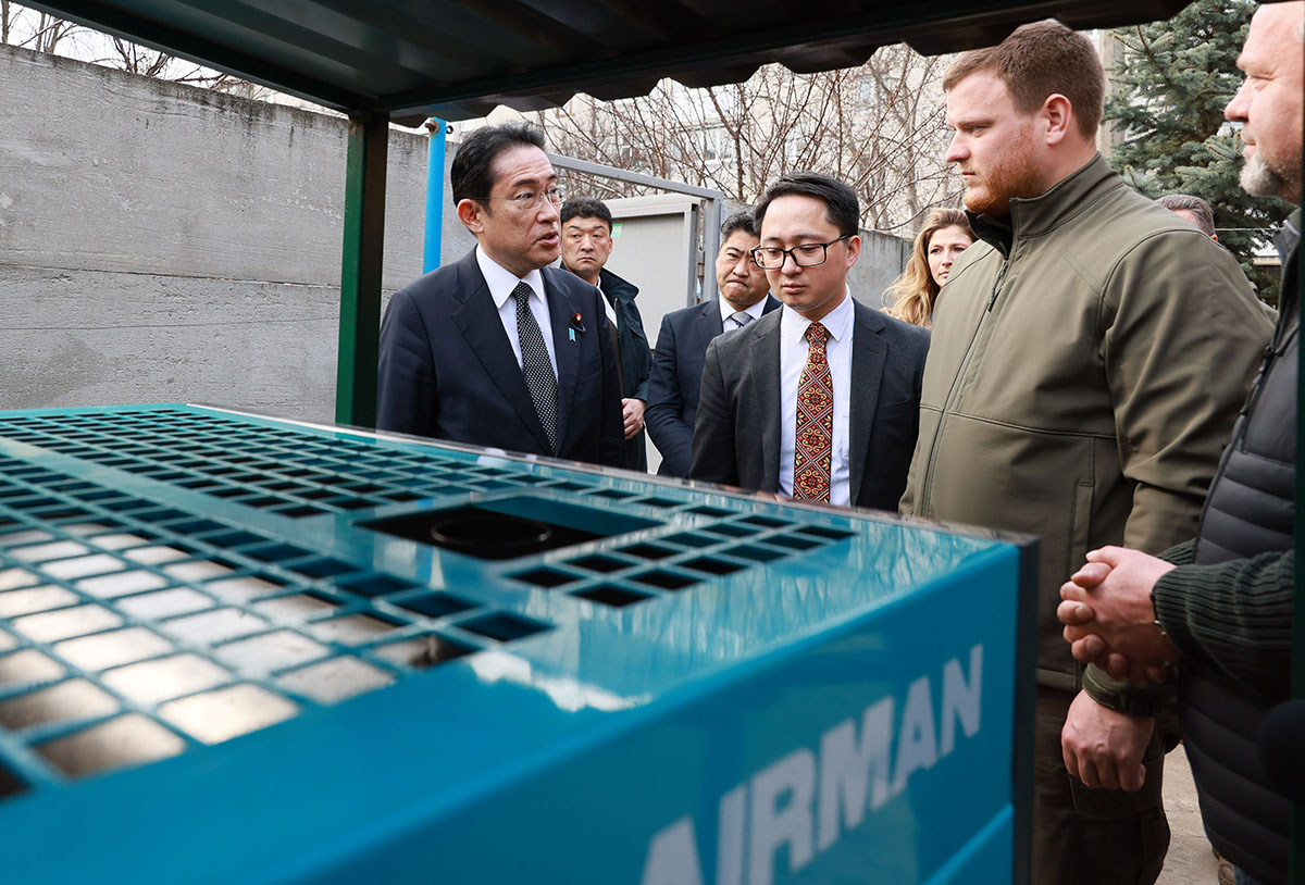 Prime Minister Fumio Kishida inspects power generators provided by the Japanese government during his visit to Bucha, Ukraine, on March 21. | CABINET PUBLIC AFFAIRS OFFICE