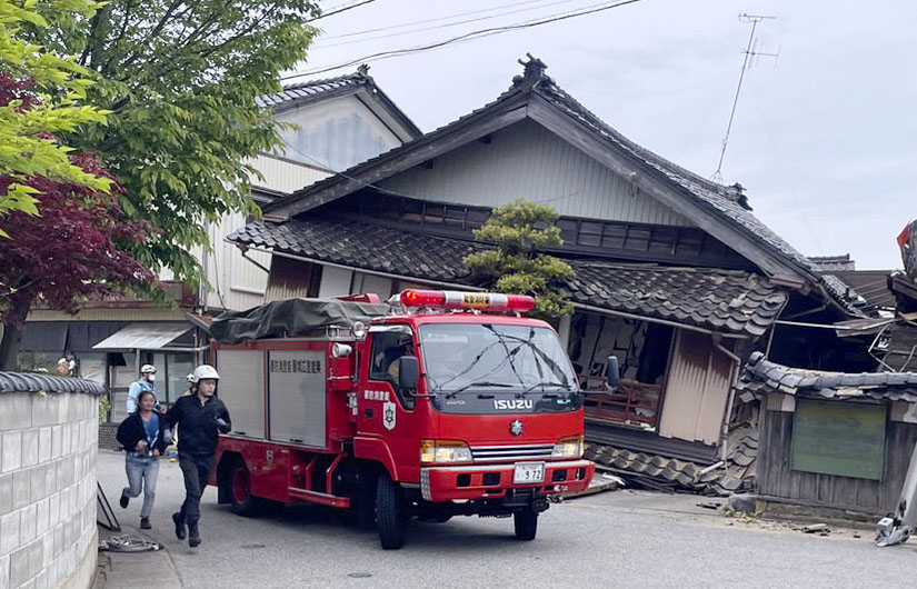 A collapsed house is seen in Suzu, Ishikawa Prefecture, after a magnitude 6.5 earthquake, which measured a strong 6 on the shindo (intensity) scale, jolted the area Friday afternoon, killing at least one and leaving others injured. | KYODO
